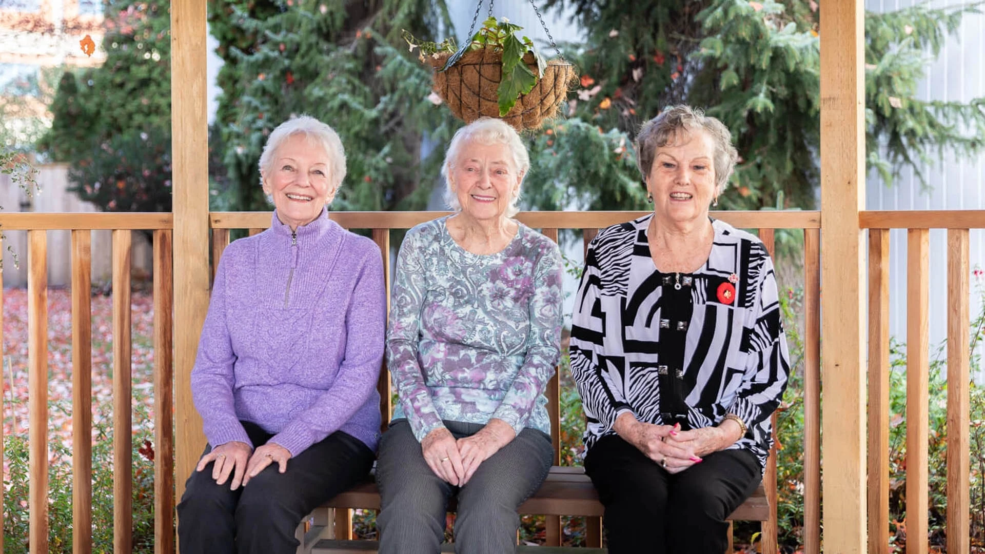3 seniors ladies sitting on a bench
