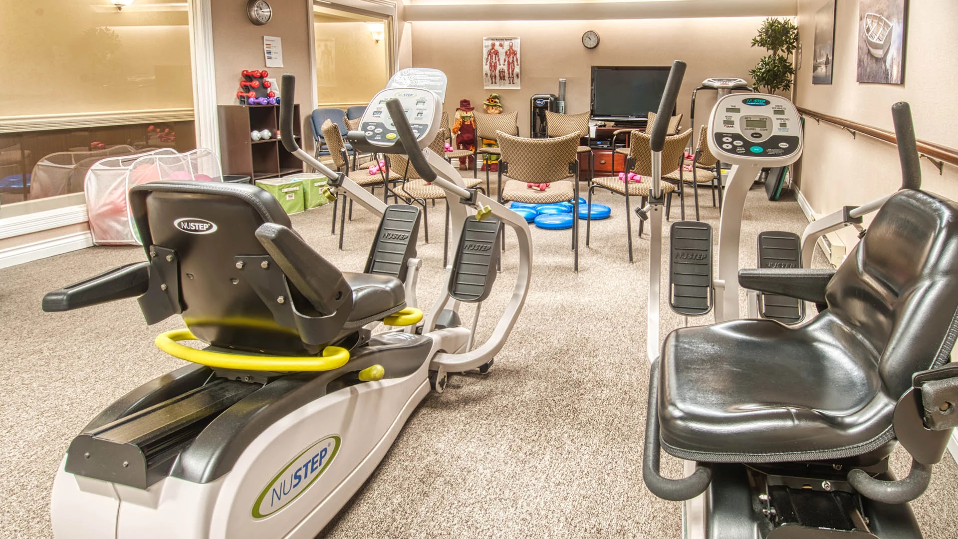 workout room with exercise equipments